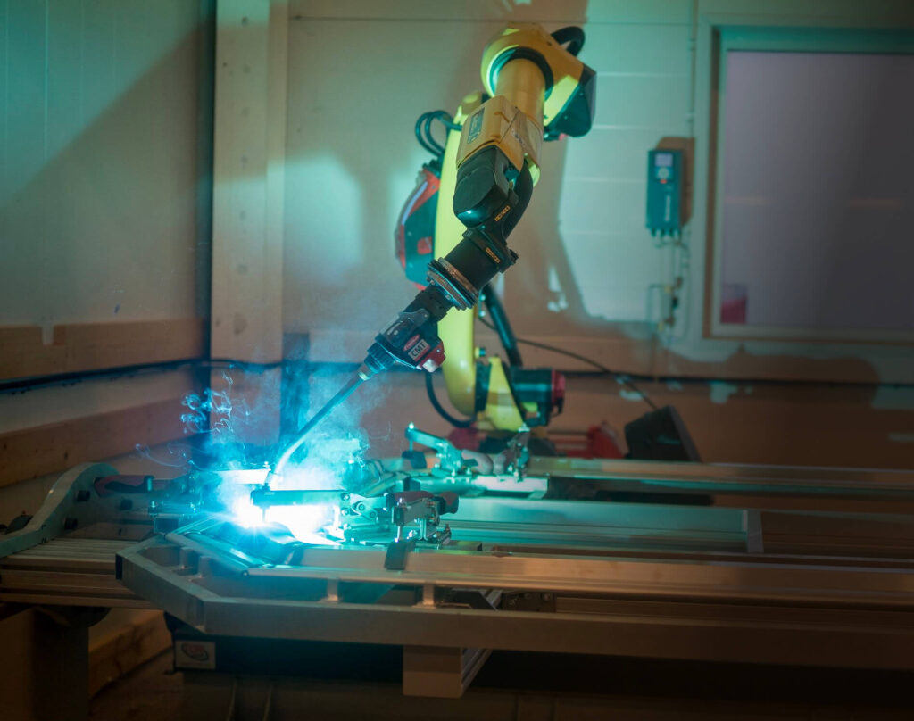 An industrial robot performs a welding operation